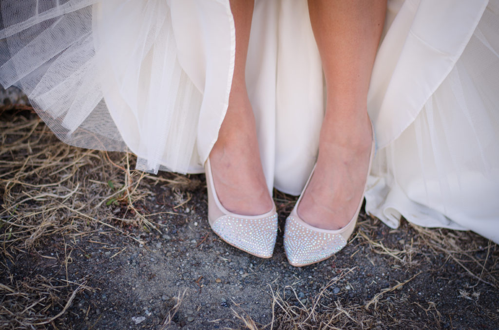 Pointed end nude sparkled heels by Betsy Johnson with white tulle dress in background